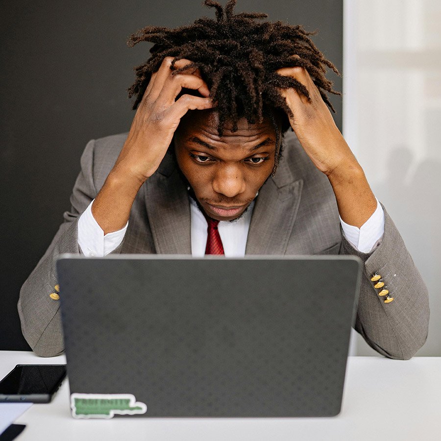 exhausted worker with laptop